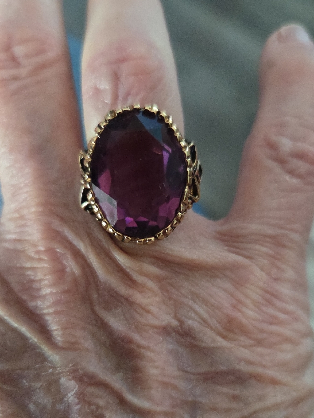 Gold-Tone Ring with Deep Purple Oval Gemstone - 14 kt gold filled